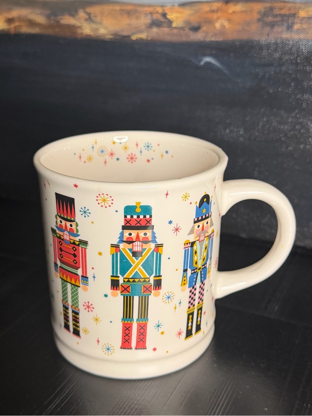 Sur La Table Cream Ceramic Mug with Multicolored Nutcracker Pattern